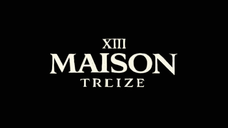 Neon sign with 'MAISON TREIZE' on a gray background